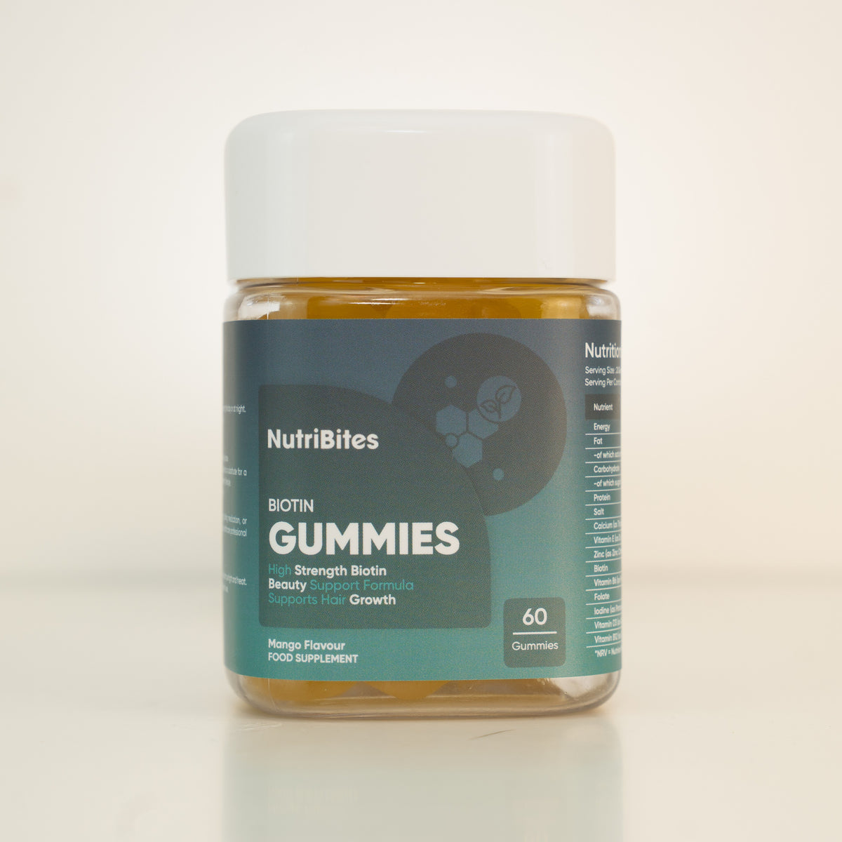 NutriBites Biotin Gummies, mango flavour: jar of 60 gummies on a studio background