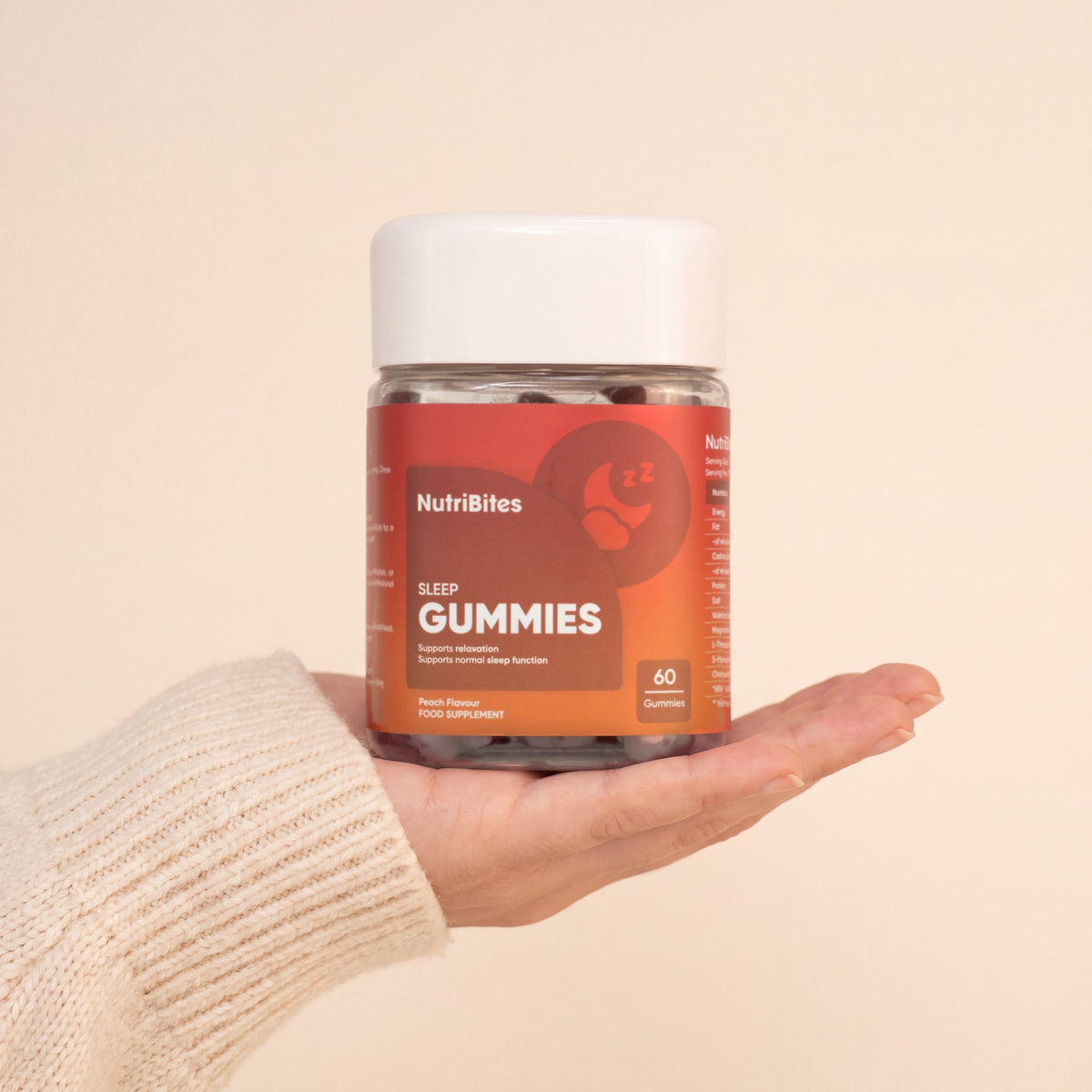 NutriBites Magnesium Gummies with Chamomile, peach flavour: jar held in a hand